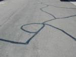 A photograph of crack seal street treatment. 