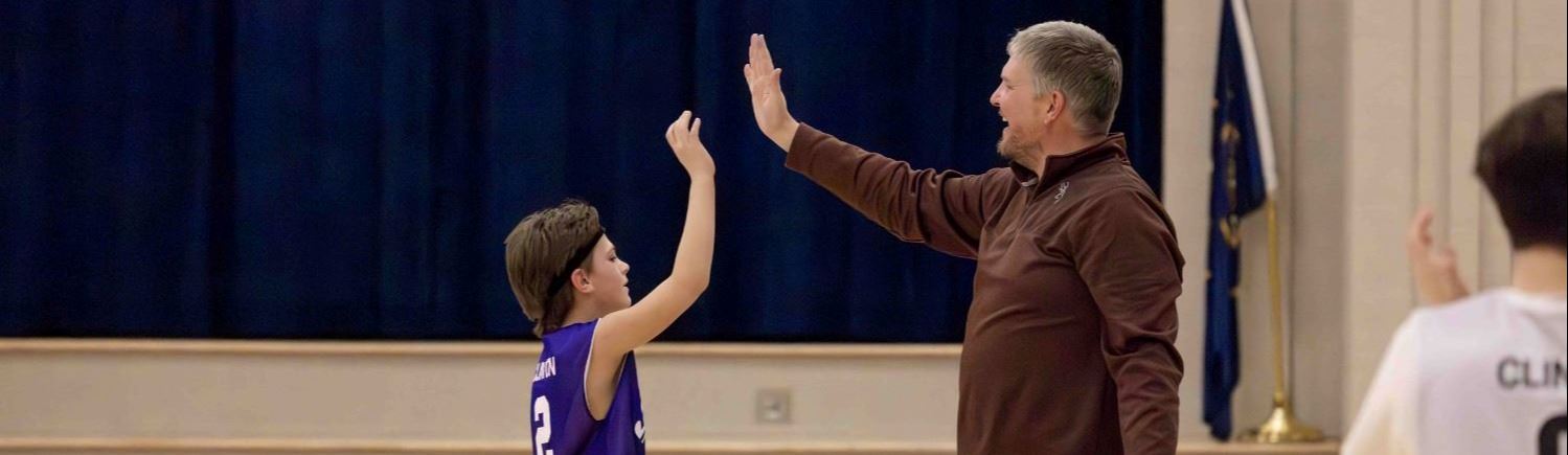 A coach giving a player a high five